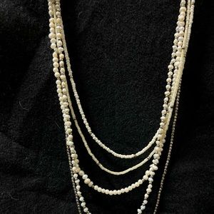 Multi length pearl and sterling bead necklace. Brown leather sliding knot